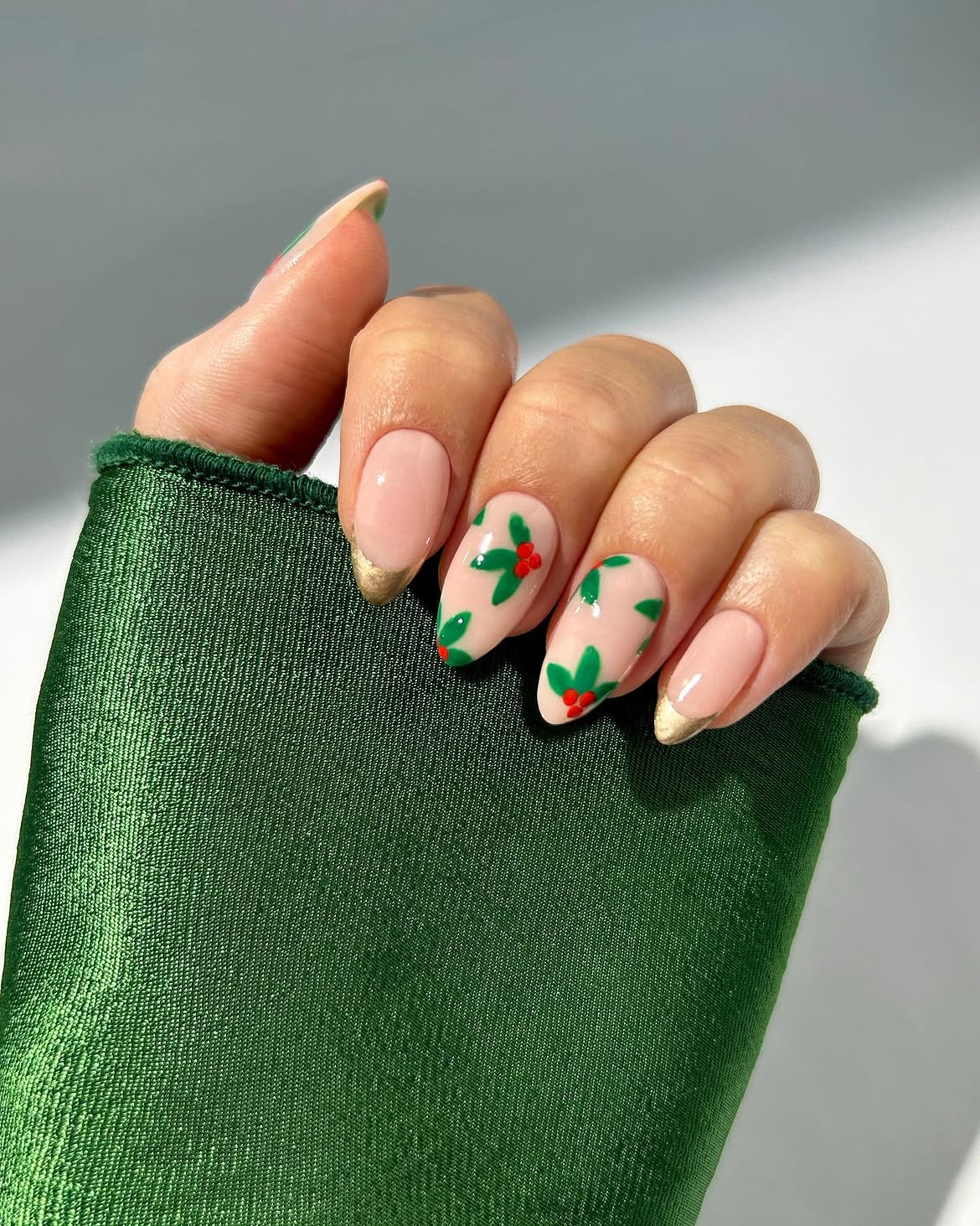 Glossy Almond Nails with Gold Tips and Holly