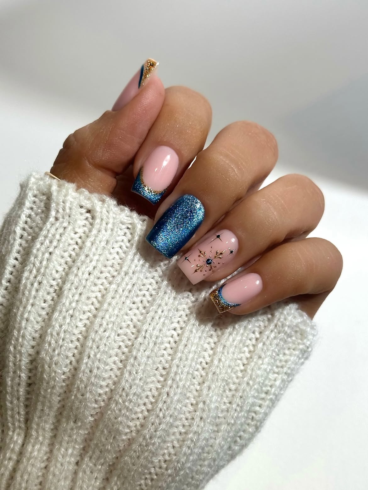 Glossy Blue Cat Eye Snowflake Winter Nails