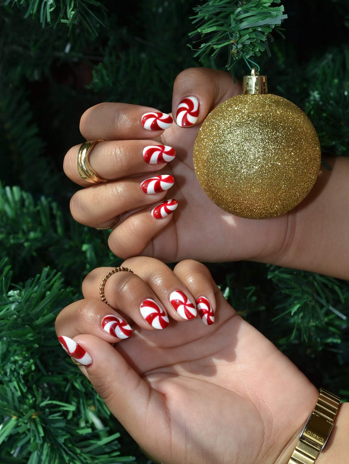 Glossy Candy Cane Swirl Almond Nails
