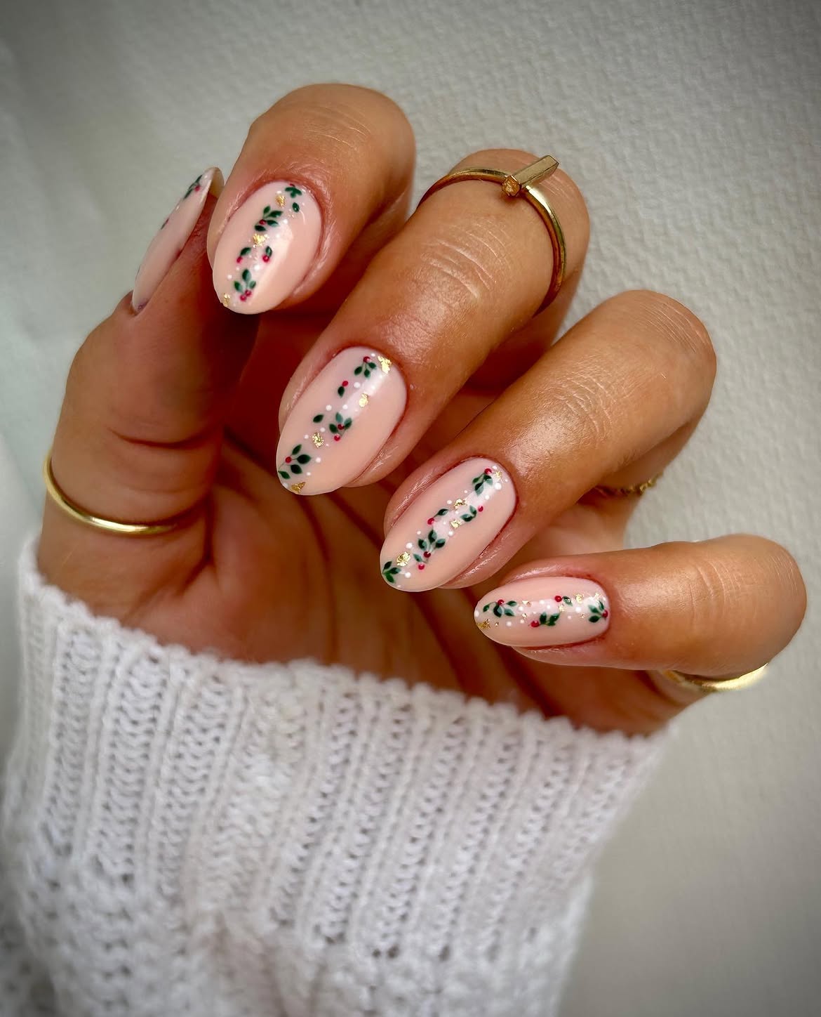 Glossy Nude Almond Nails With Hand Painted Christmas Holly