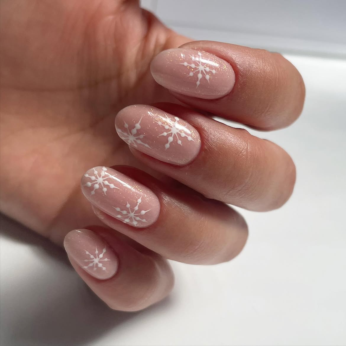 Glossy Nude Shimmer Almond Snowflake Nails