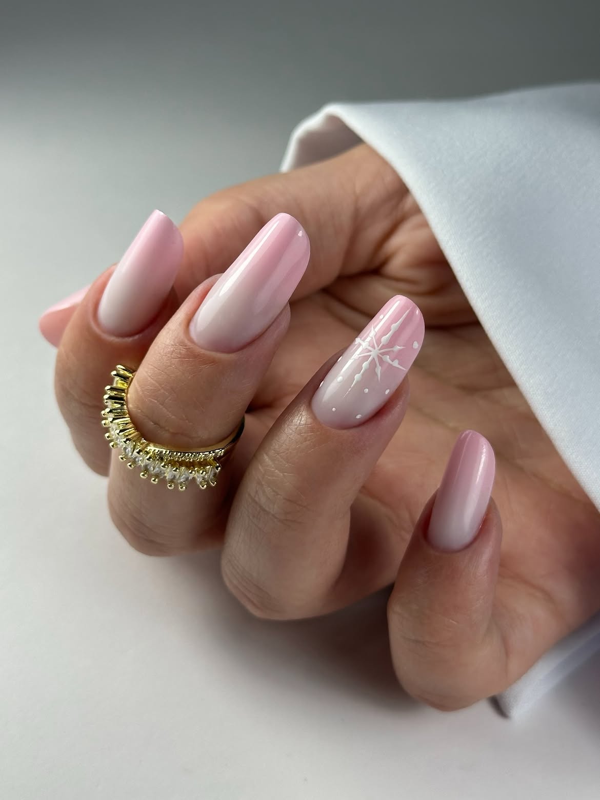 Glossy Pink Ombre Nails With White Snowflakes