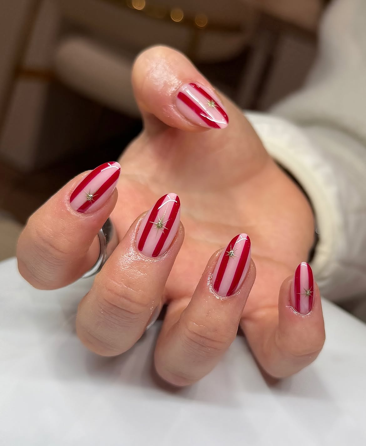 Glossy Red Striped Candy Cane Almond Nails
