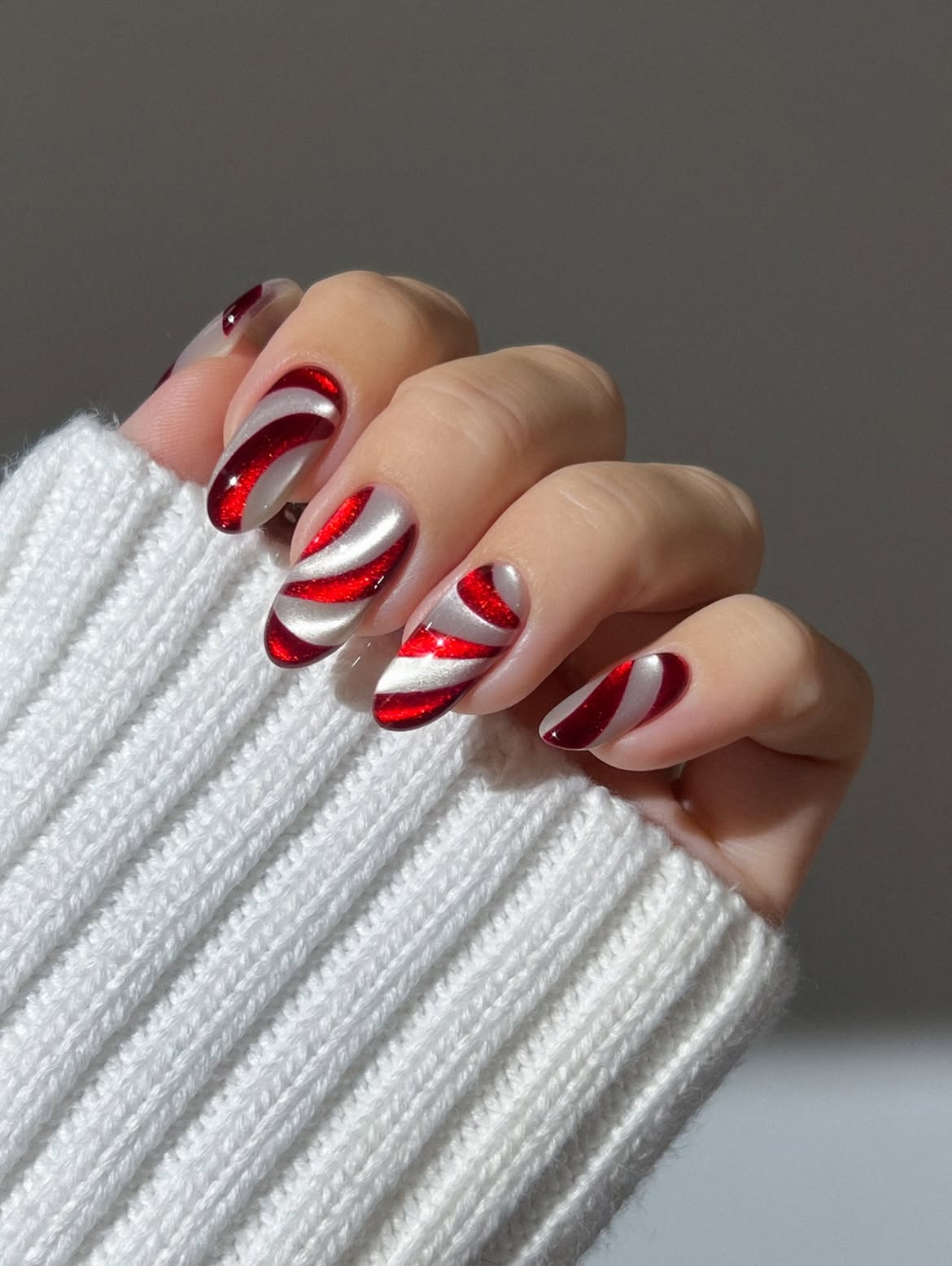 Glossy Red Velvet Candy Cane Swirl Almond Nails