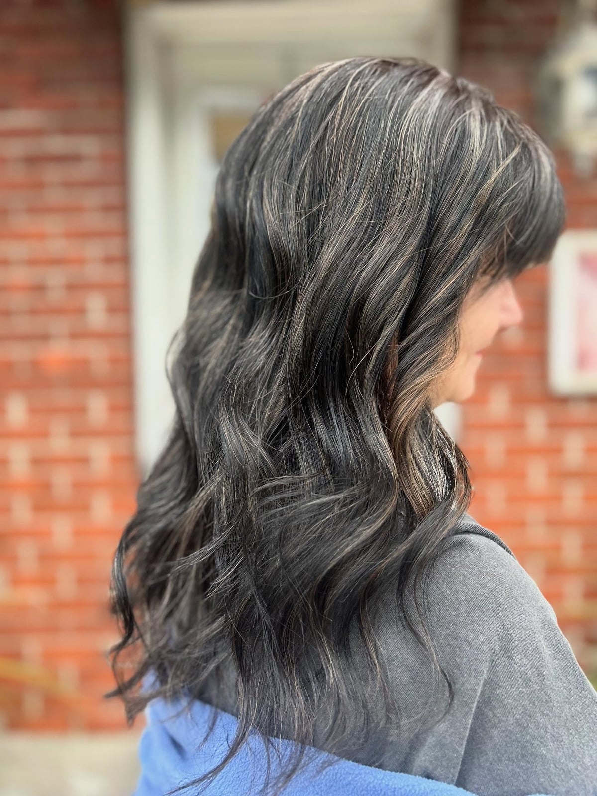 Mid-Back Layers With Wavy Blowout and Gray Blend — Gray Blending Hair