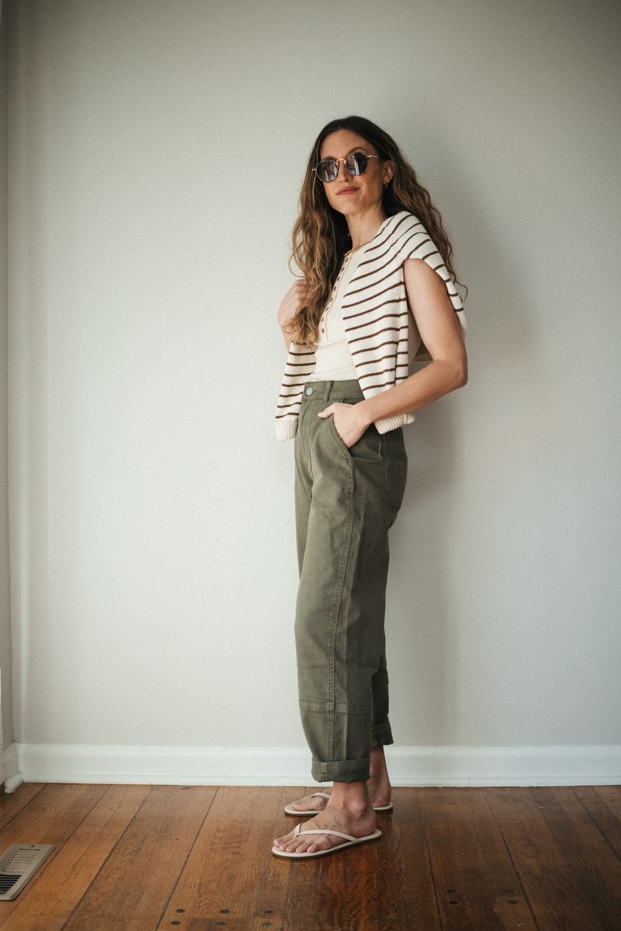 Olive Green Cargo Pants with Sweater Draped Over Shoulders — Green Cargo Pants Outfit