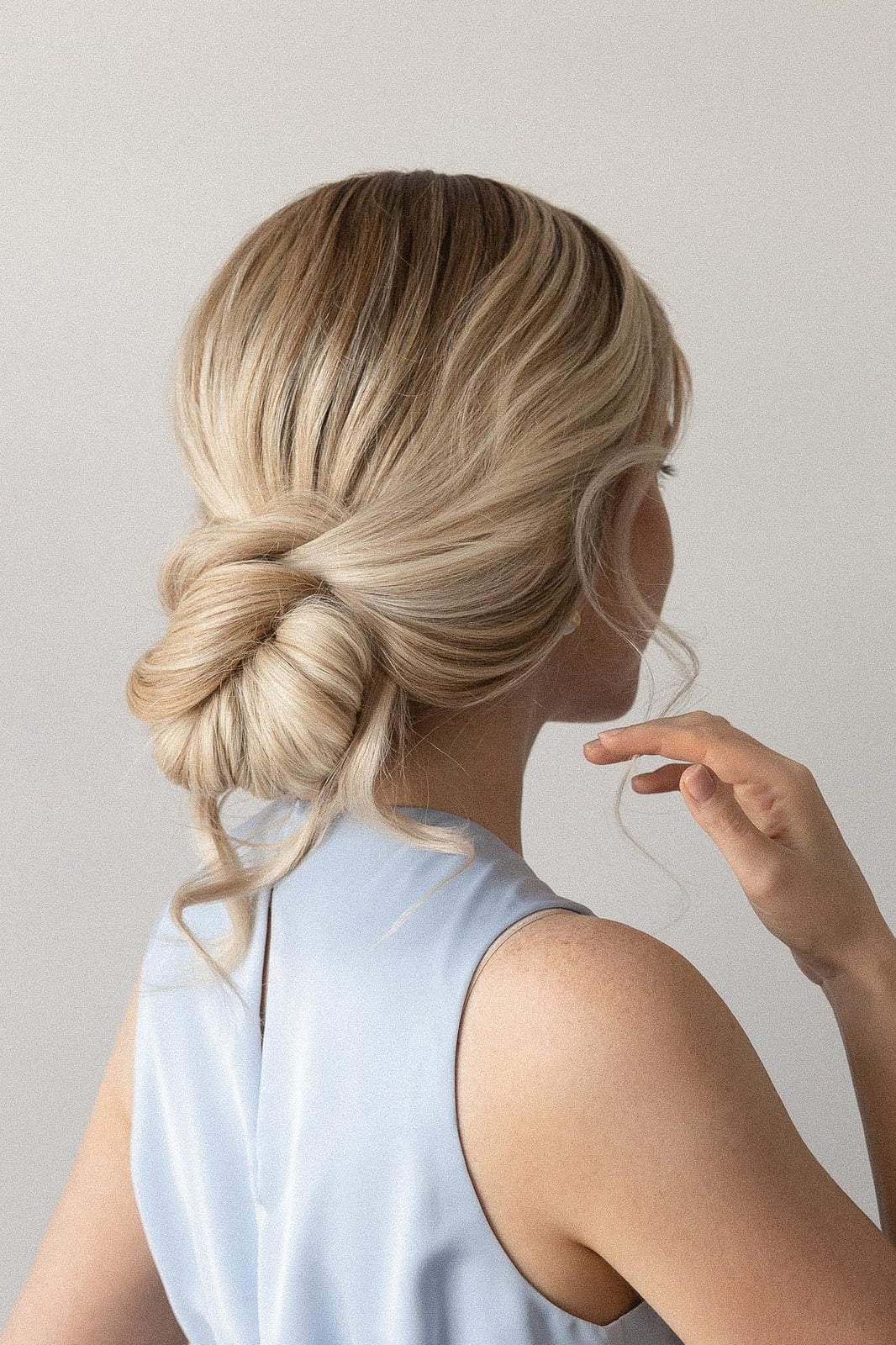 Low Twisted Bun With Romantic Tendrils — Hair Up Hairstyles