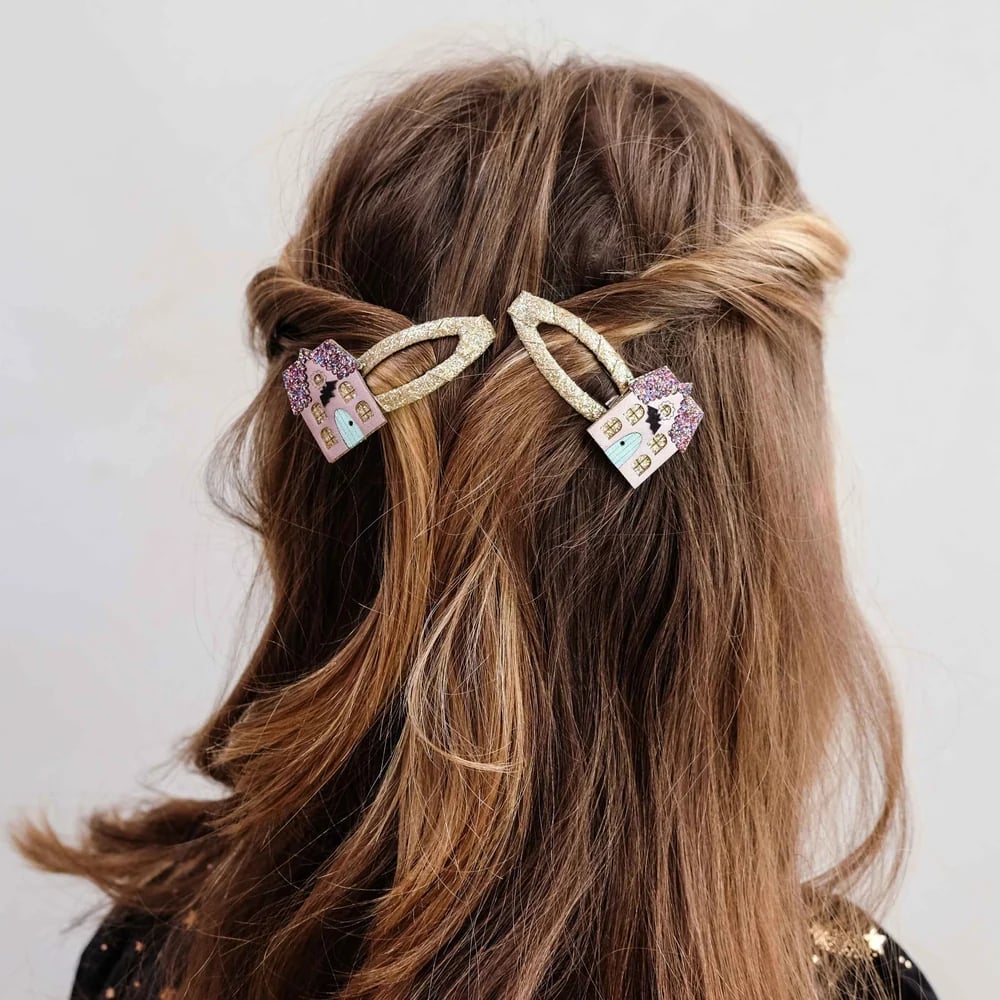 Mid-Back Medium Brown Twisted Sections with Decorative Clips Mid-Back Medium Brown Twisted Sections with Decorative Clips — Hair with Clips