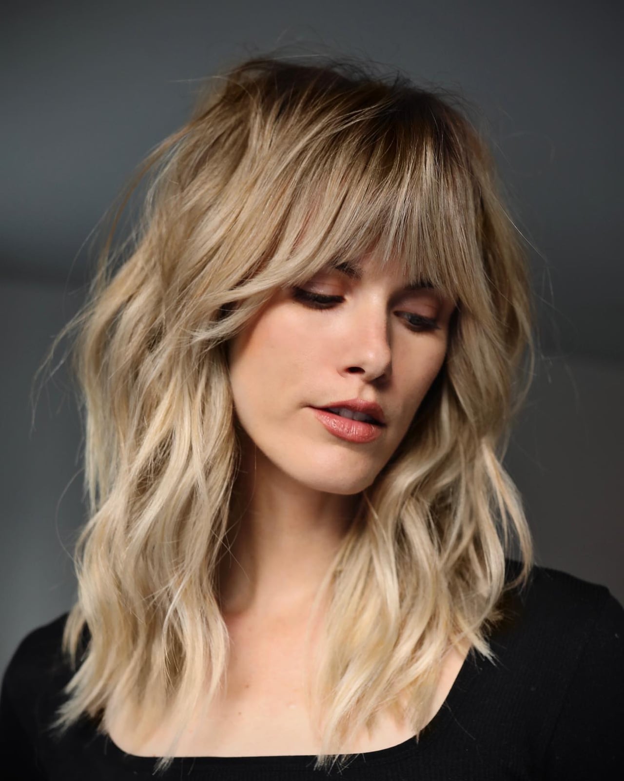 Collarbone Shag With Blonde Root Shadow Collarbone Shag With Blonde Root Shadow — Haircuts for Wavy Hair