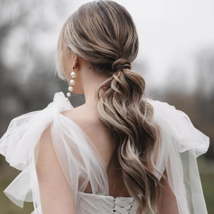 Dark Brown Updo With Braided Accents and Floral Accessory Dark Brown Updo With Braided Accents and Floral Accessory — Hairstyles for Wedding