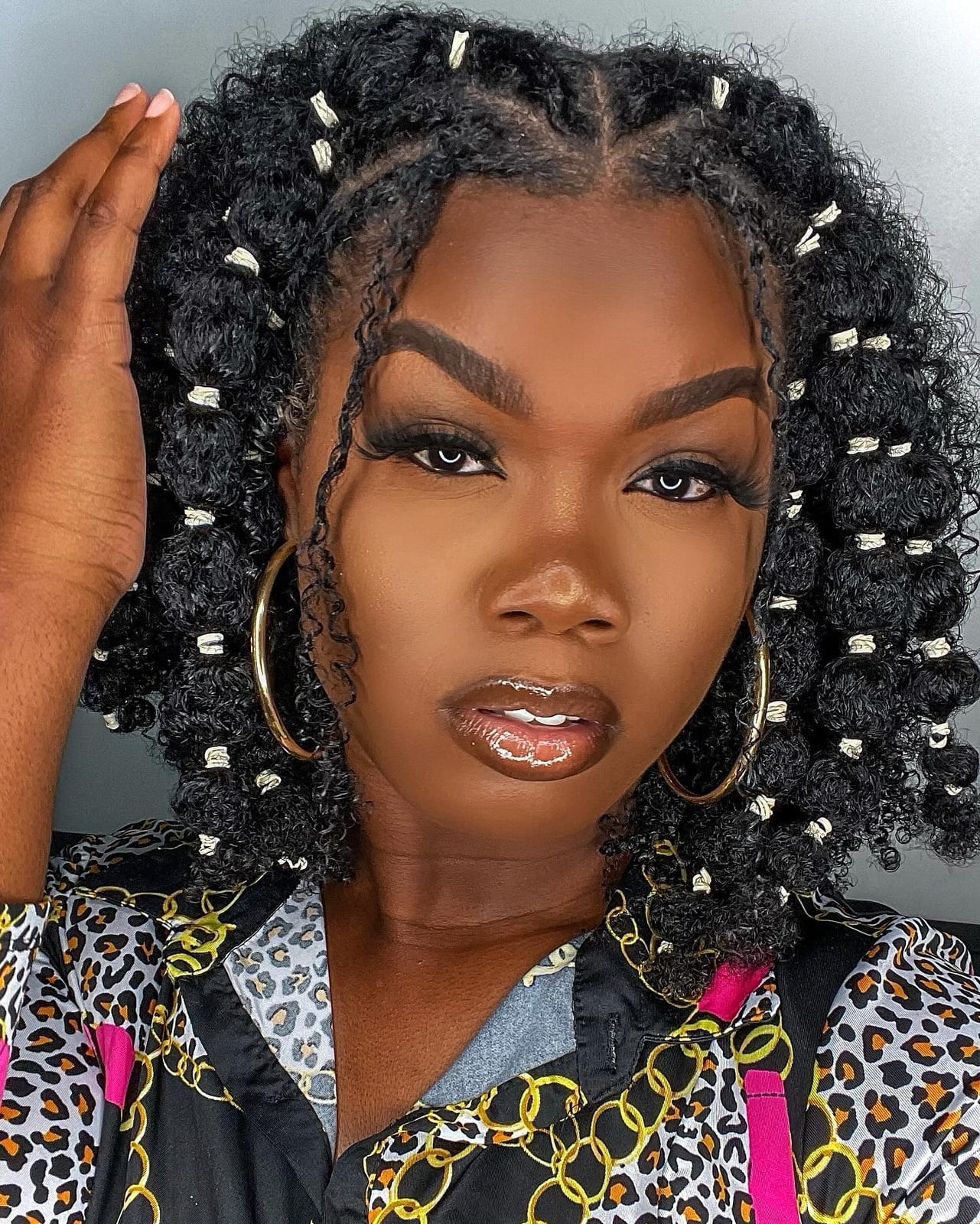 Shoulder Black Curls With Braids and Beads — Hairstyles to Do