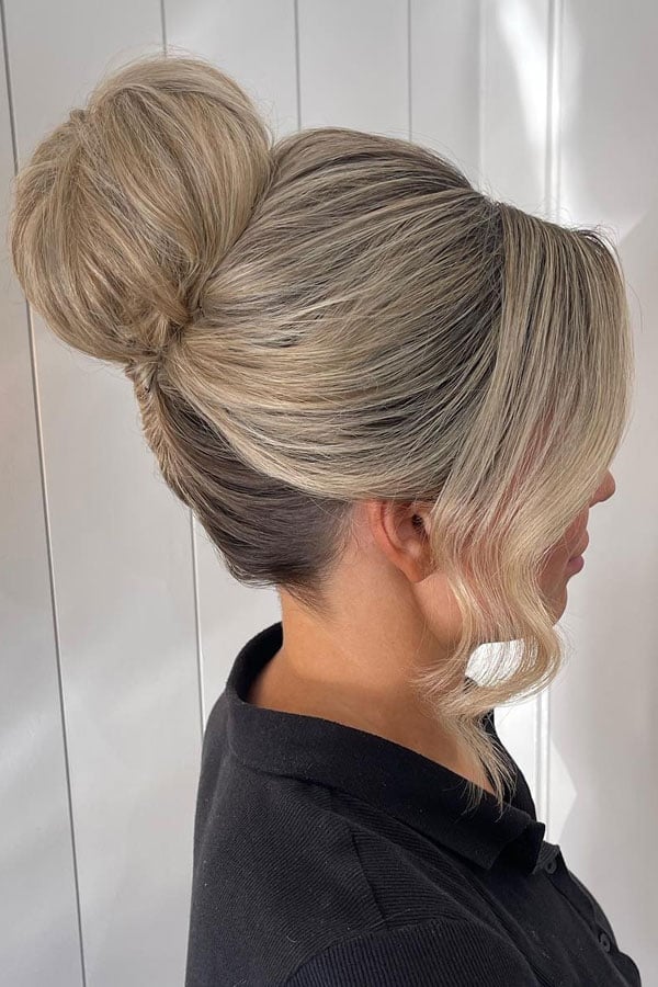 Voluminous Blonde Updo Curtain Bangs Voluminous Blonde Updo Curtain Bangs — High Bun Hairstyles