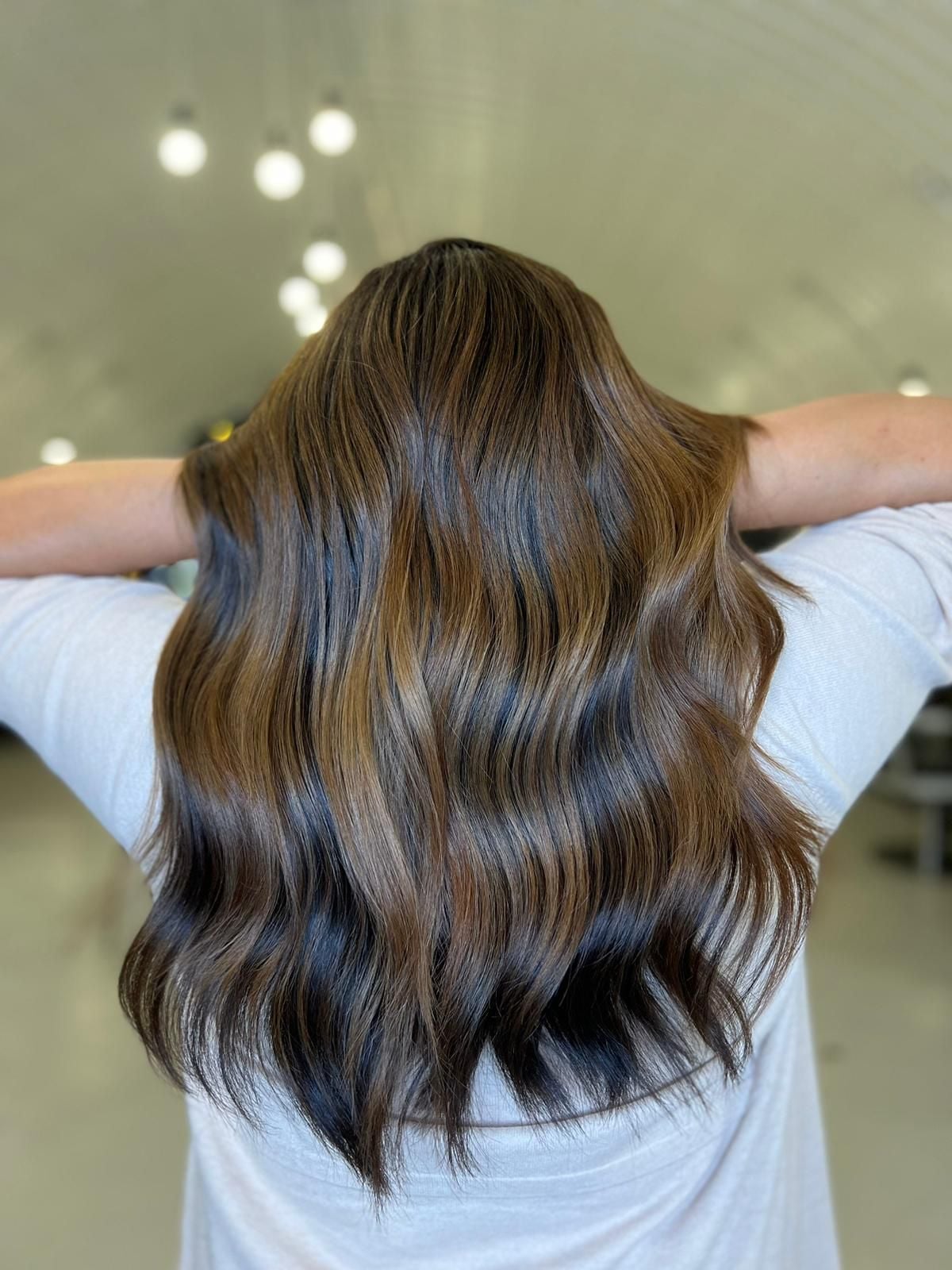 Medium Brown Mid-Back With Lighter Highlights and Wavy Blowout — Highlights in Brown Hair