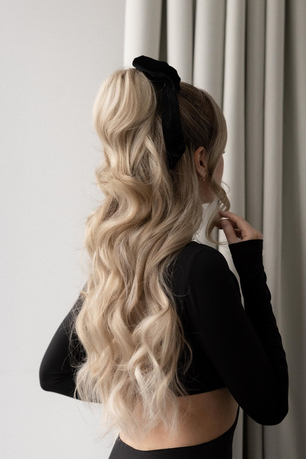 Platinum Blonde High Ponytail With Curls Platinum Blonde High Ponytail With Curls — Holiday Hairstyles