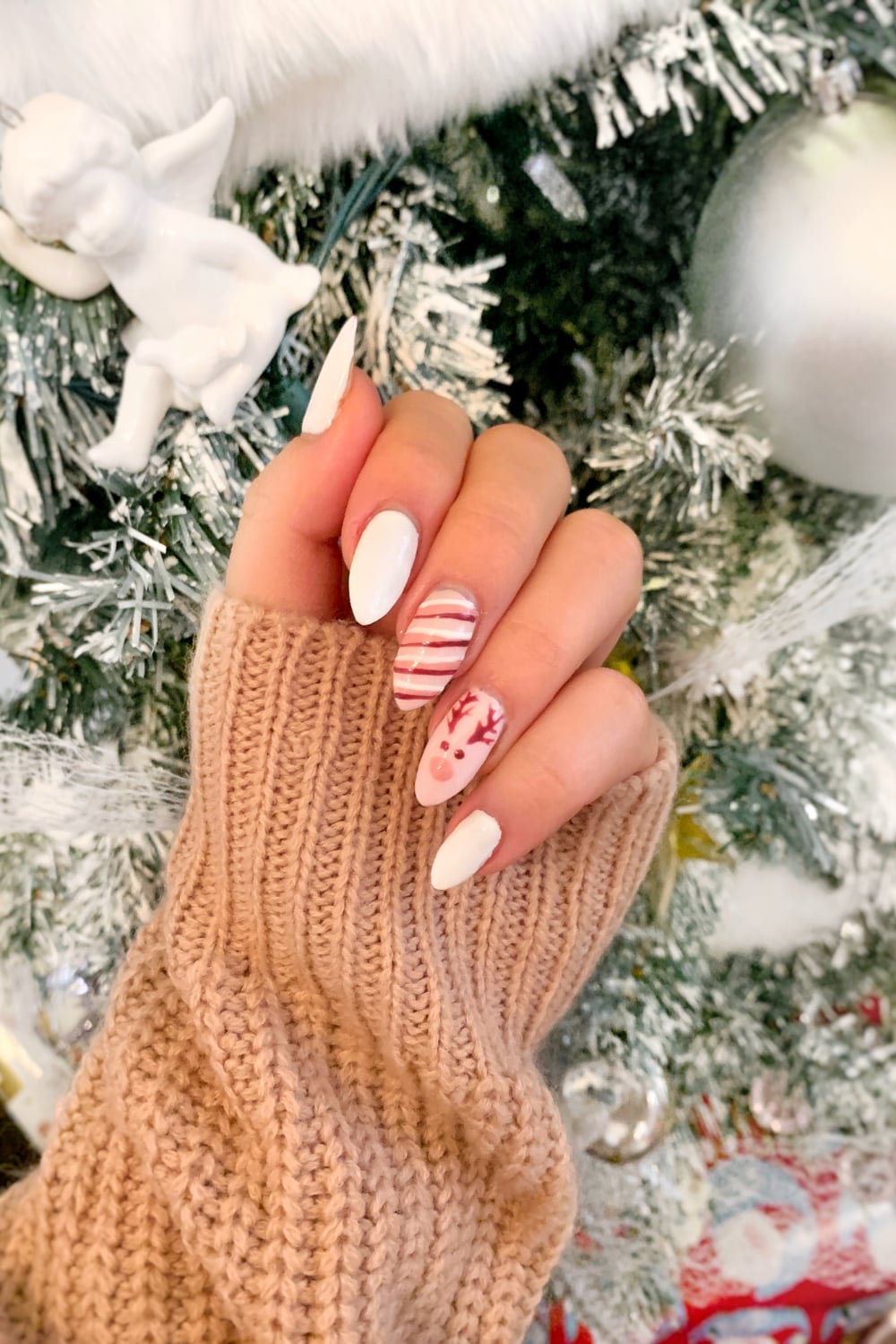 Medium Almond Reindeer Face Stripe Nails Medium Almond Reindeer Face Stripe Nails — Holiday Nail Designs