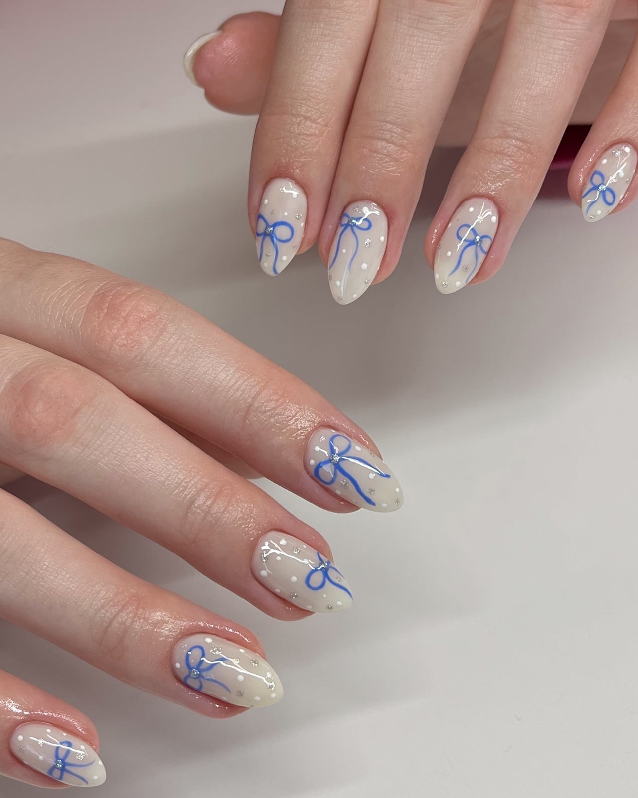 Medium Almond Blue Bow and White Dot Nails Medium Almond Blue Bow and White Dot Nails — Holiday Nails