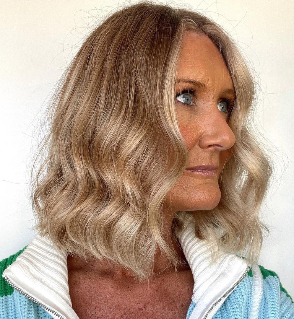 Chin Length Honey Blonde Bob With Side-Swept Bangs