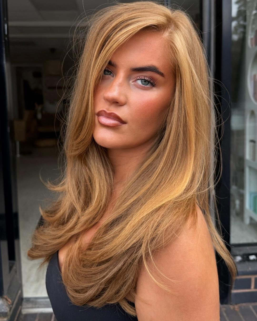 Mid-Back Honey Blonde Balayage With Voluminous Waves