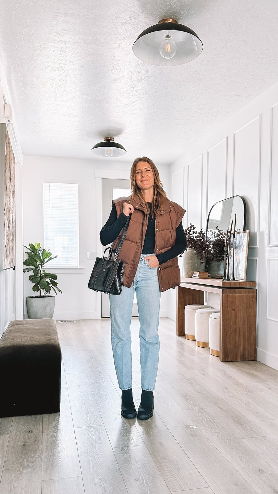 Brown Puffer Vest Over Black Top and Jeans Brown Puffer Vest Over Black Top and Jeans — House Outfit Ideas
