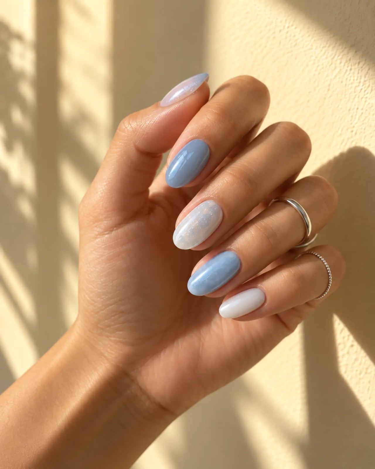 Mixed Finish Oval Nails with Shimmer Accents, And Sheer Milky Polish — Icy Blue Nails