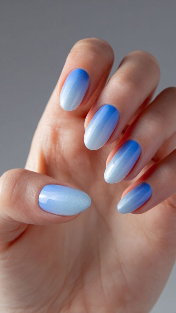 Shimmering White to Deep Icy Blue Ombre Oval Nails — Icy Blue Nails