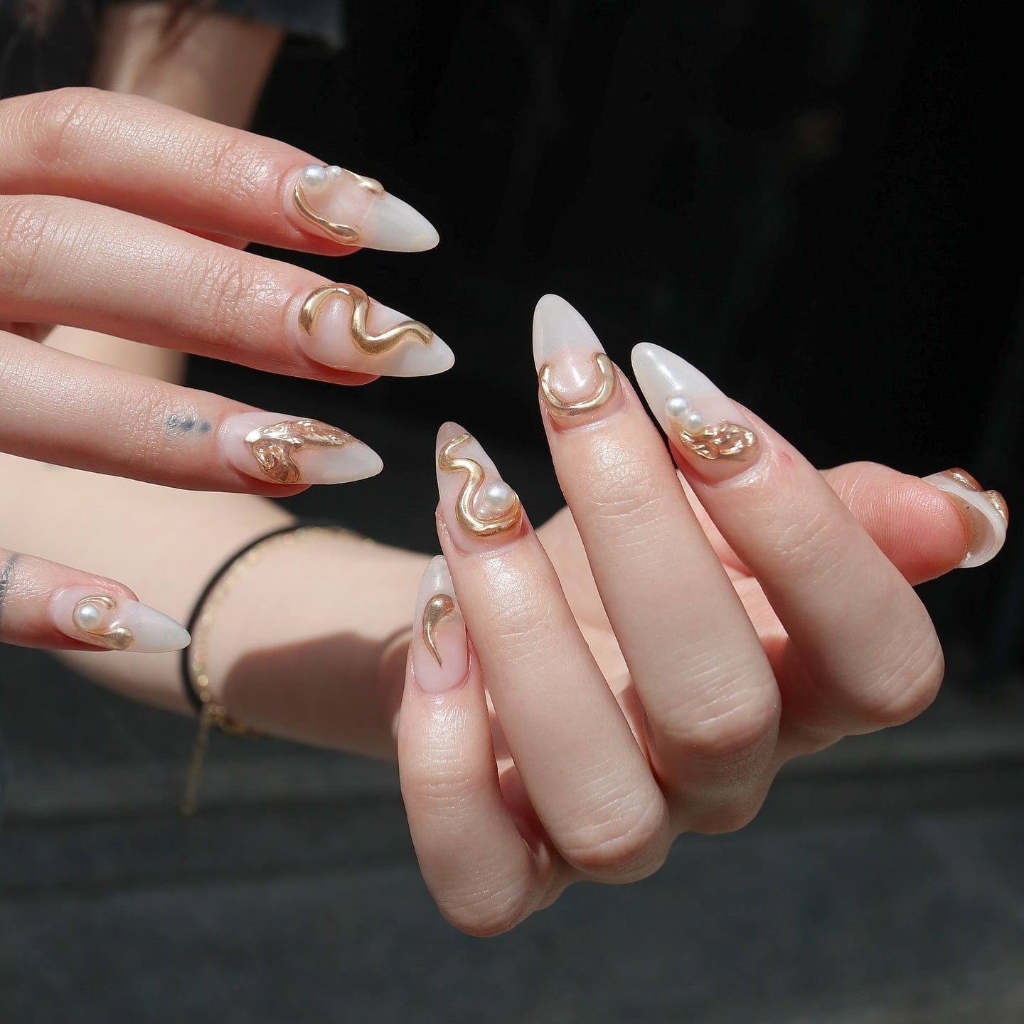 Sculptural Gold Accents on Milky White Almond Nails — Korean Nail Art