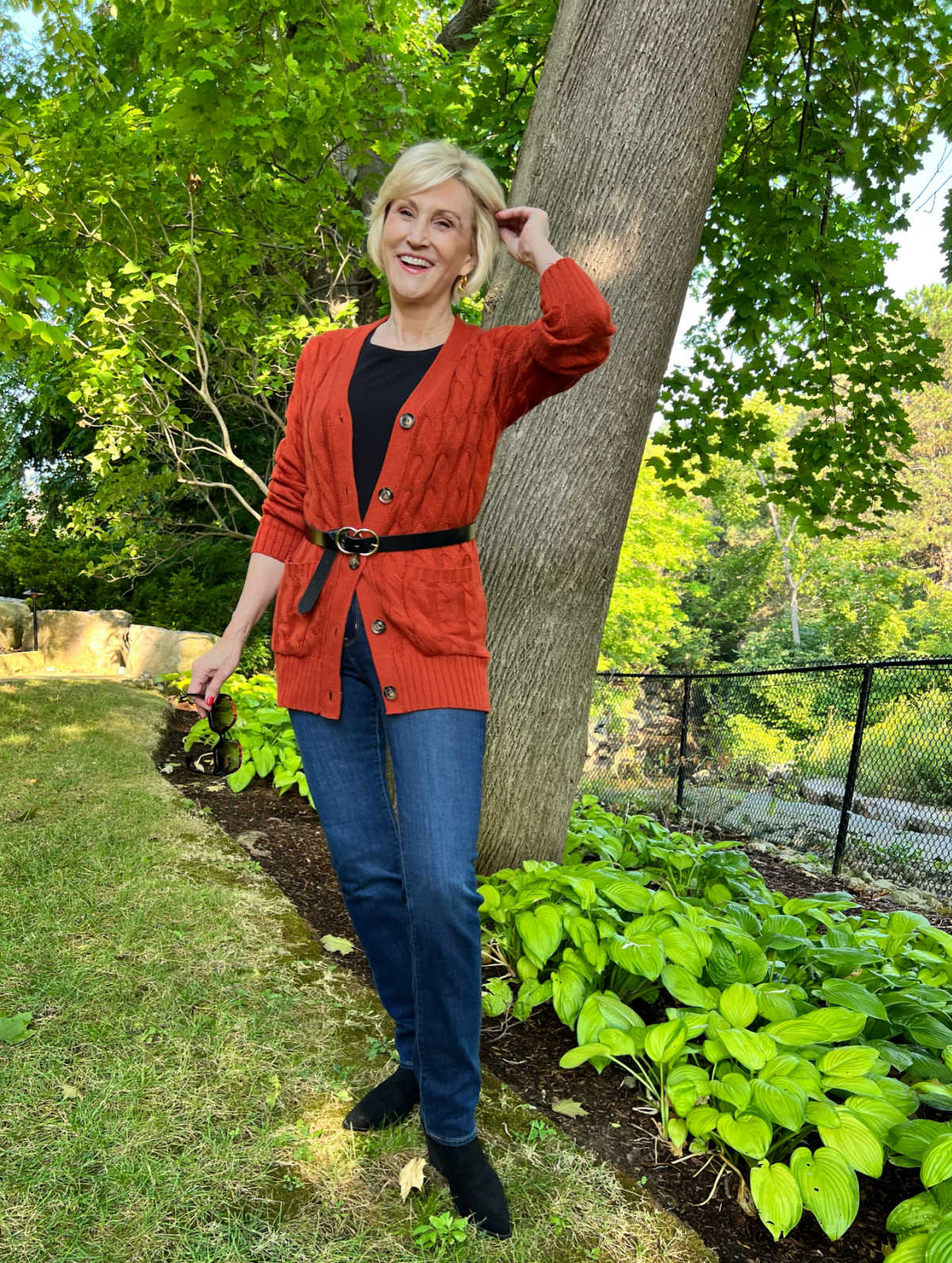 Orange Cable Knit Cardigan Over Black T-Shirt Orange Cable Knit Cardigan Over Black T-Shirt — Layered Ideas