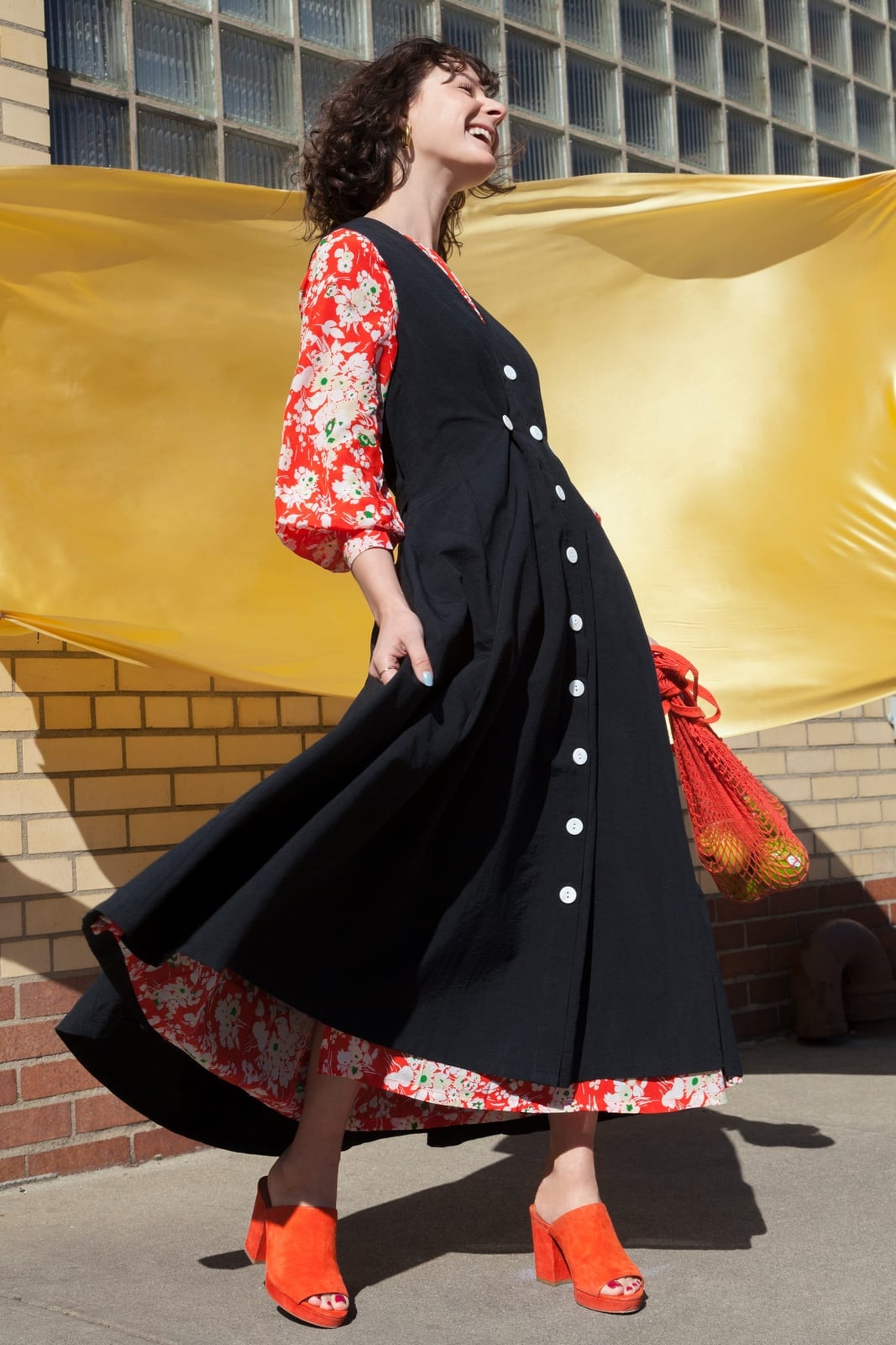 A Black Button-Front Dress Over a Floral Blouse — Layering Dress