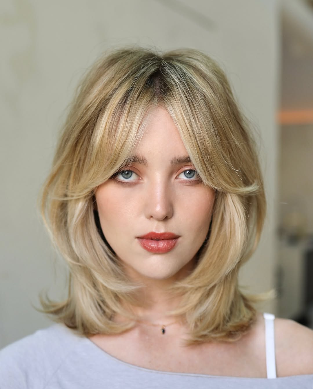 Ash Blonde Layered Lob With Curtain Bangs Ash Blonde Layered Lob With Curtain Bangs — Layers Hairstyles