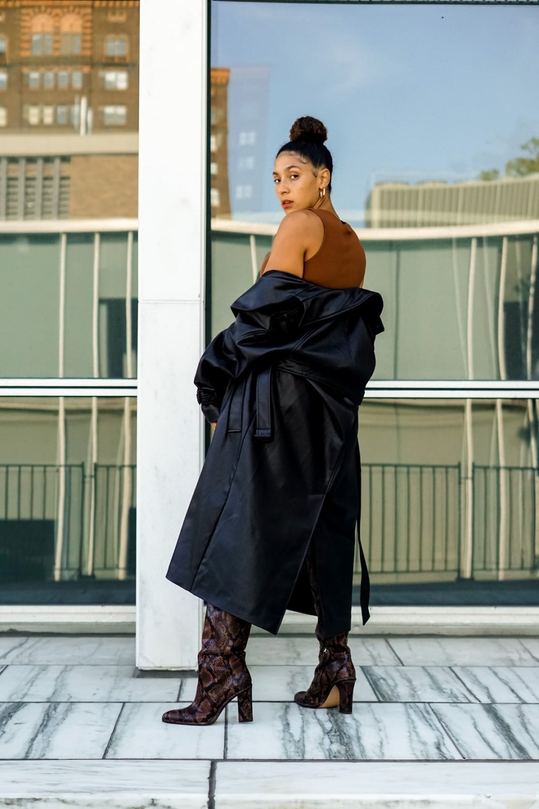 A Black Leather Trench Coat Draped Over A Top A Black Leather Trench Coat Draped Over A Top — Leather Outfits