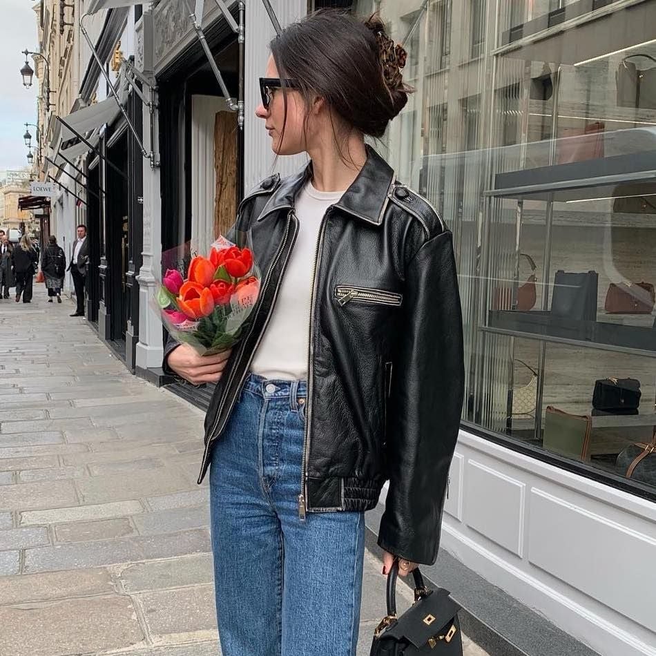 A Black Leather Biker Jacket With Blue Jeans A Black Leather Biker Jacket With Blue Jeans — Leather Outfits