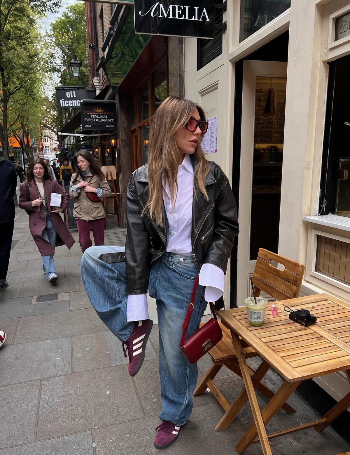 An Oversized Black Leather Jacket With Burgundy Sneakers An Oversized Black Leather Jacket With Burgundy Sneakers — Leather Outfits