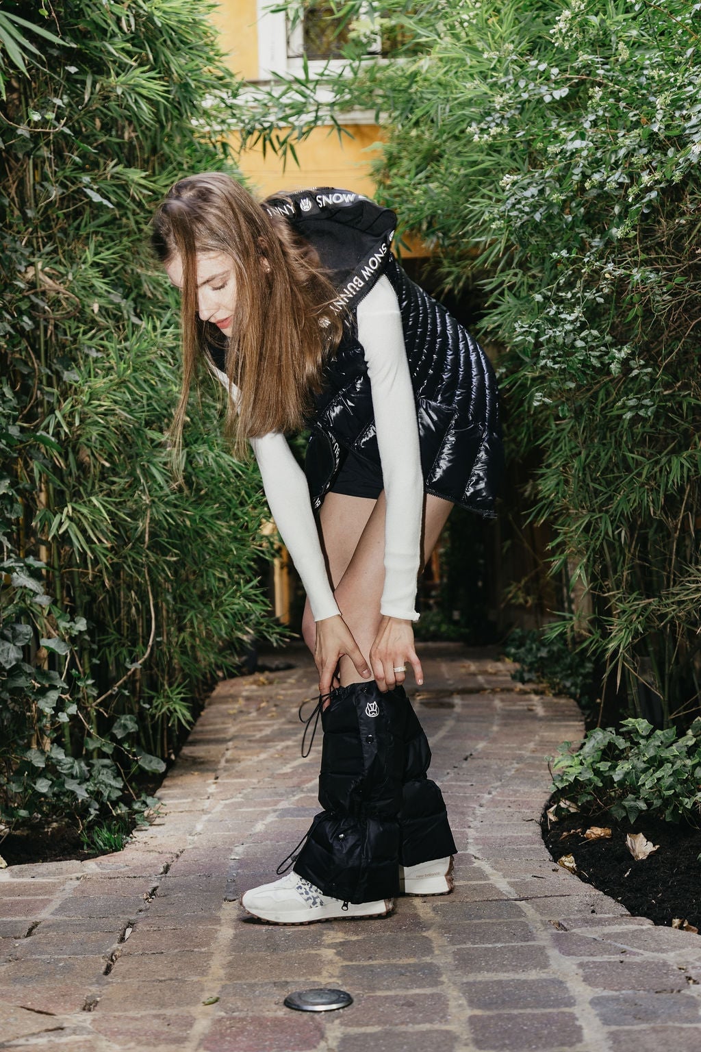 Black Leg Warmers with a Puffer Vest and Sneakers — Leg Warmers Outfits