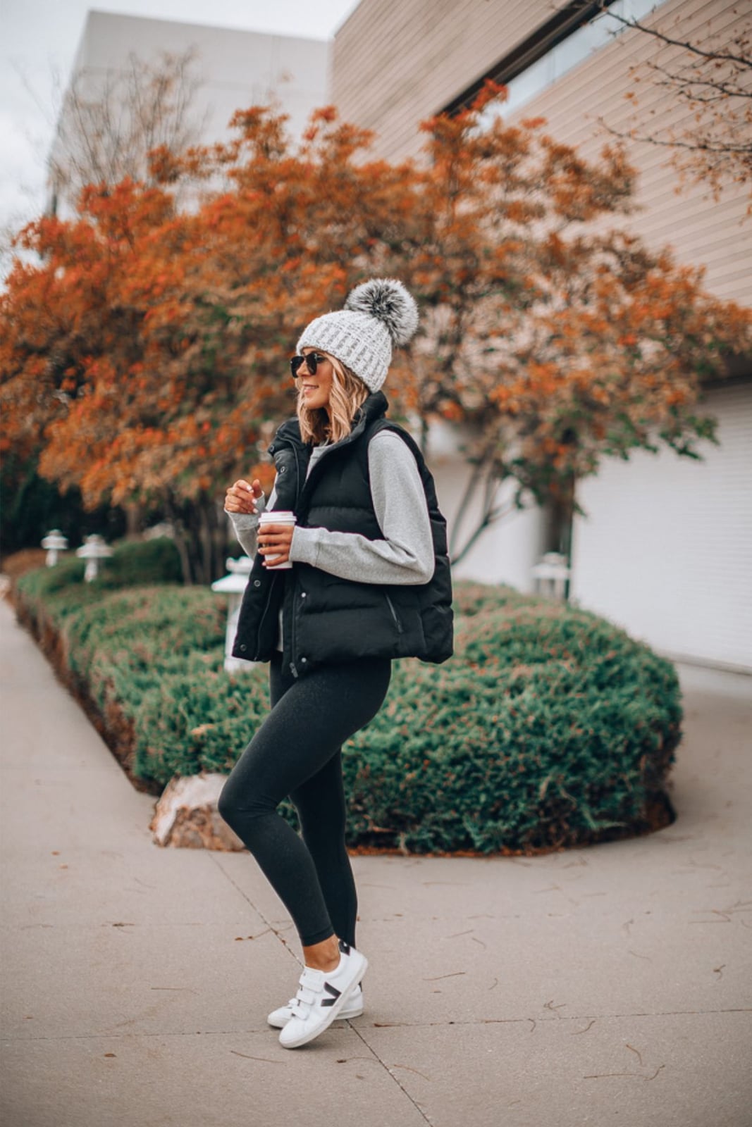 Puffer Vest with Hoodie and Dark Gray Leggings and Gray Pom-Pom Beanie Puffer Vest with Hoodie and Dark Gray Leggings and Gray Pom-Pom Beanie — Leggings Outfits Casual
