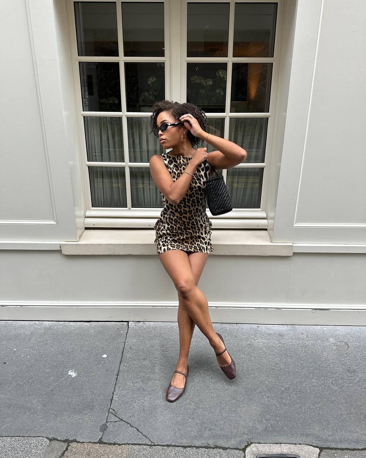 Fitted Leopard Mini Dress With Mary Jane Flats and Black Woven Handbag — Leopard Print Outfits