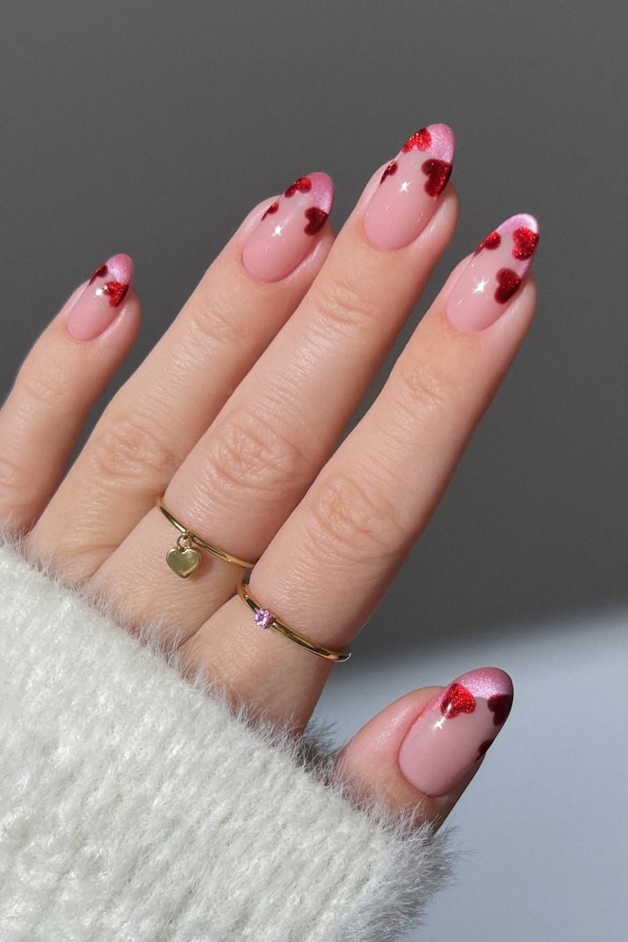 Medium Almond Sheer Pink Red Heart Nails, Close-Up Take — Looks Nail