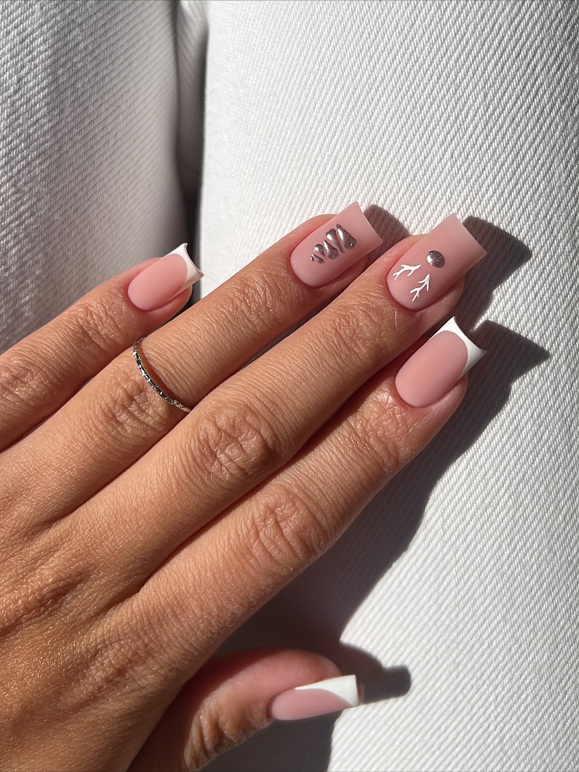 Matte Pink French Tip Nails with Silver Winter Art
