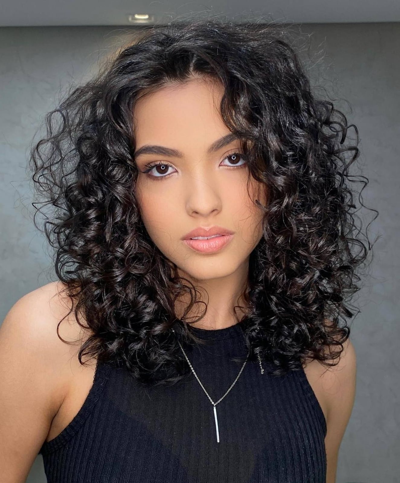 Collarbone Dark Brown Layers With Volume — Medium Curly Hair