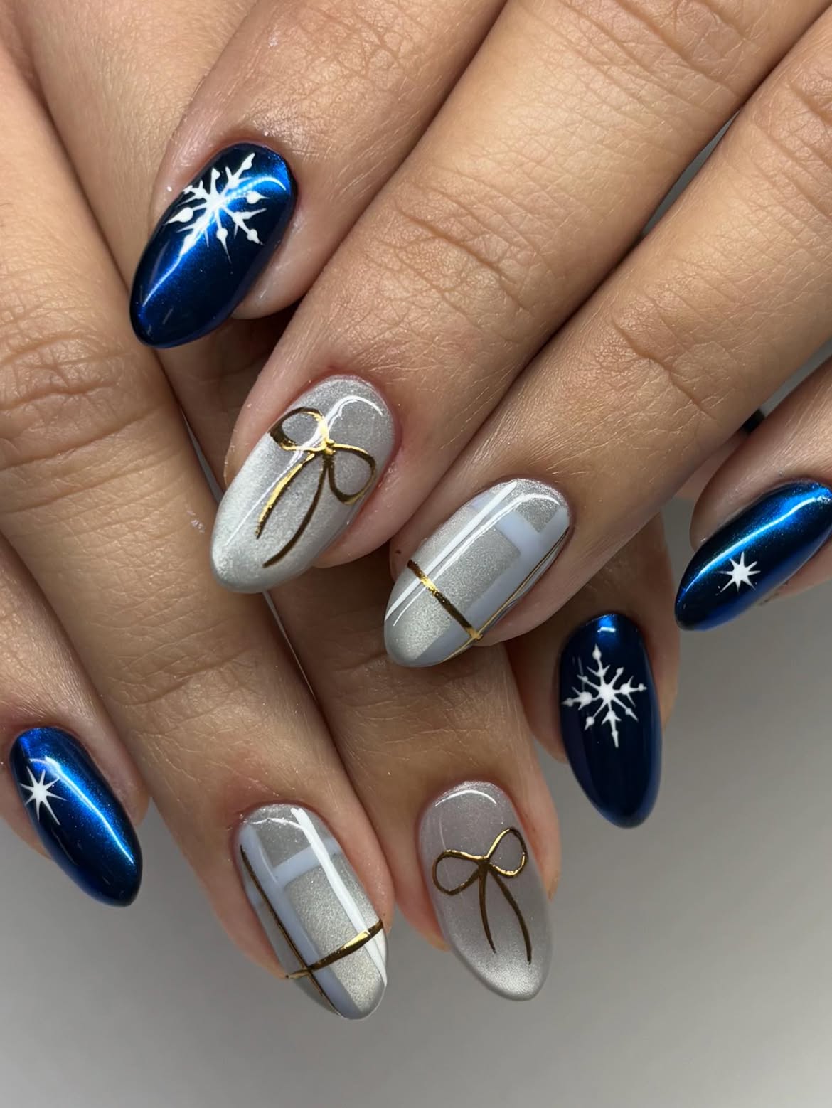 Metallic Blue Snowflake Bow Nails