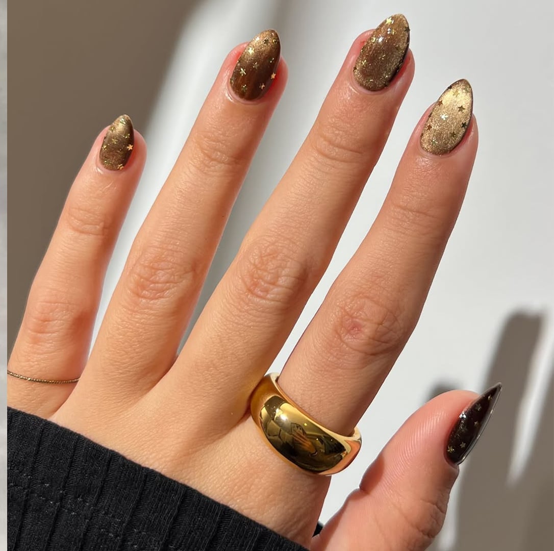 Bronze Shimmer with Gold Star Glitter Medium Almond Nails — Metallic Nails