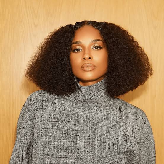 Voluminous Curly Dark Brown Bob — Middle Part Bob