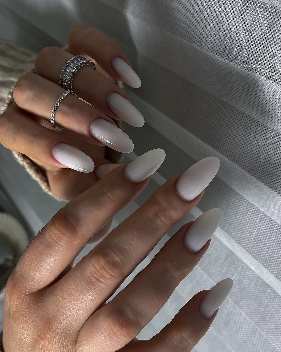 Milky White Almond Nails With Subtle Shimmer
