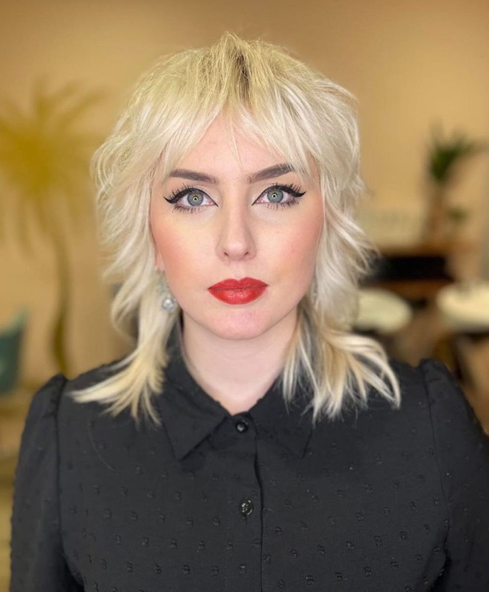 Platinum Blonde Shag With Wispy Bangs Platinum Blonde Shag With Wispy Bangs — Modern Shag
