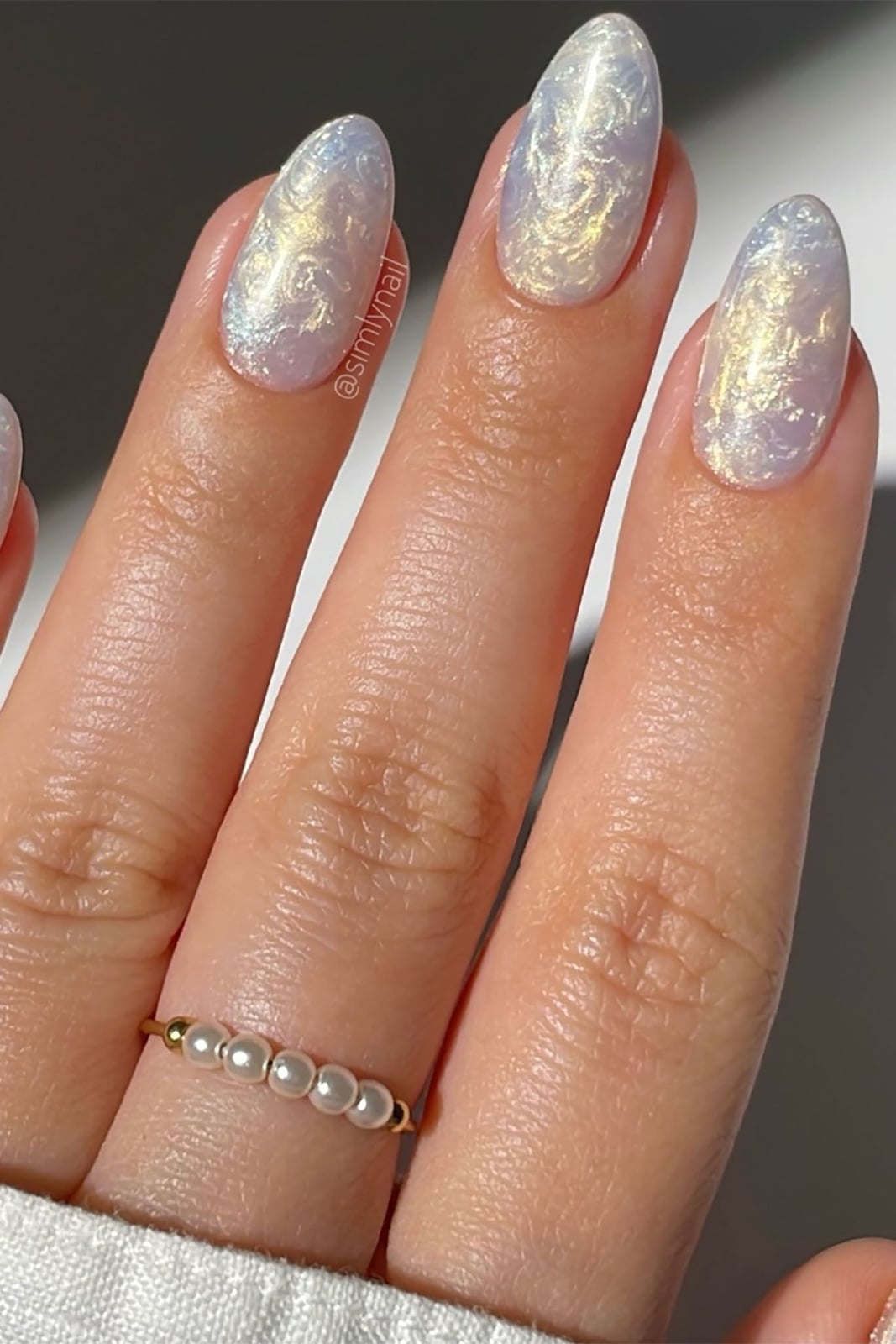 Milky White Medium Oval Nails With Blue And Gold Swirls — Nail Designs