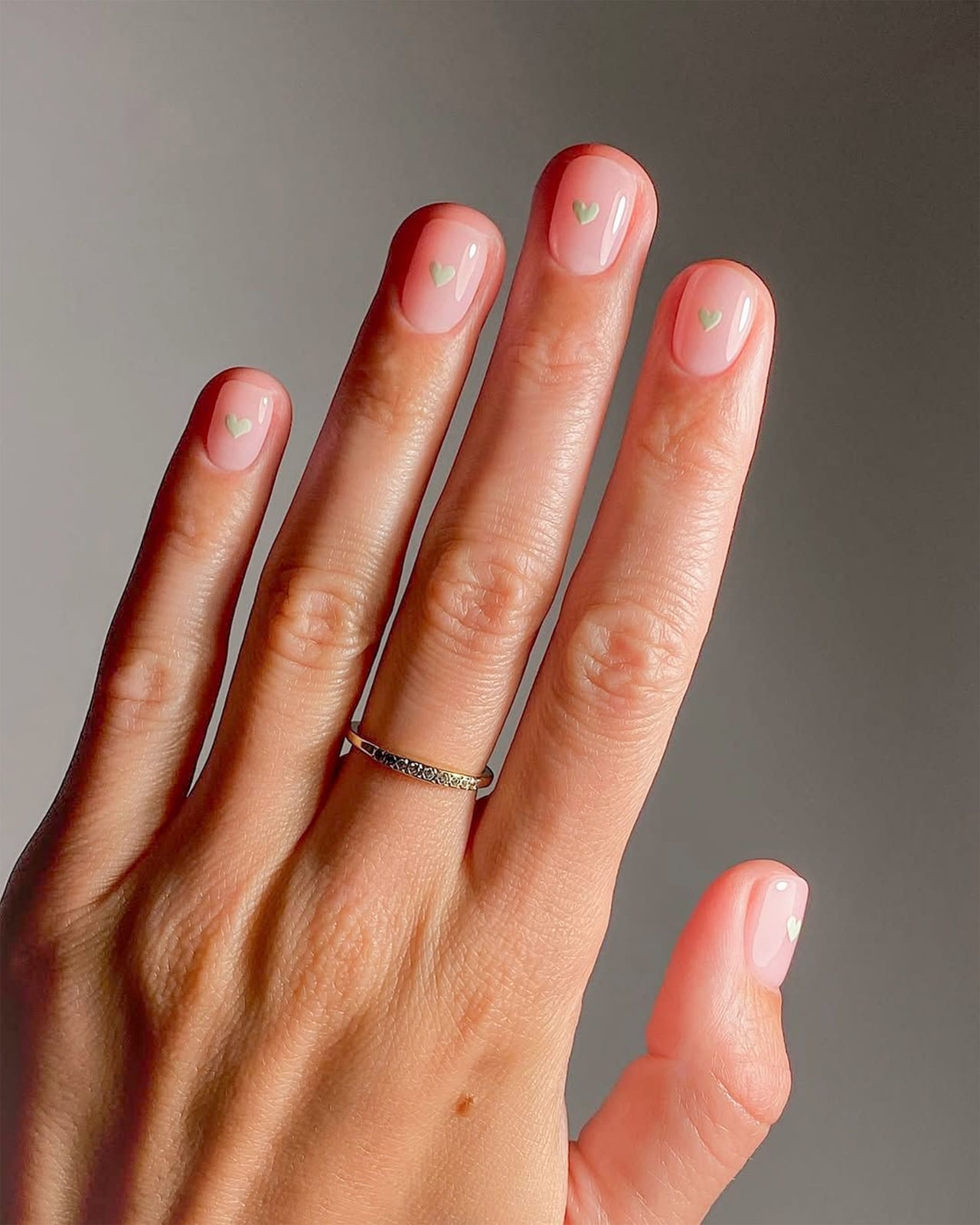 Sheer Pale Pink Short Oval Nails with Green Hearts, Glossy — Neutral Nails Colors