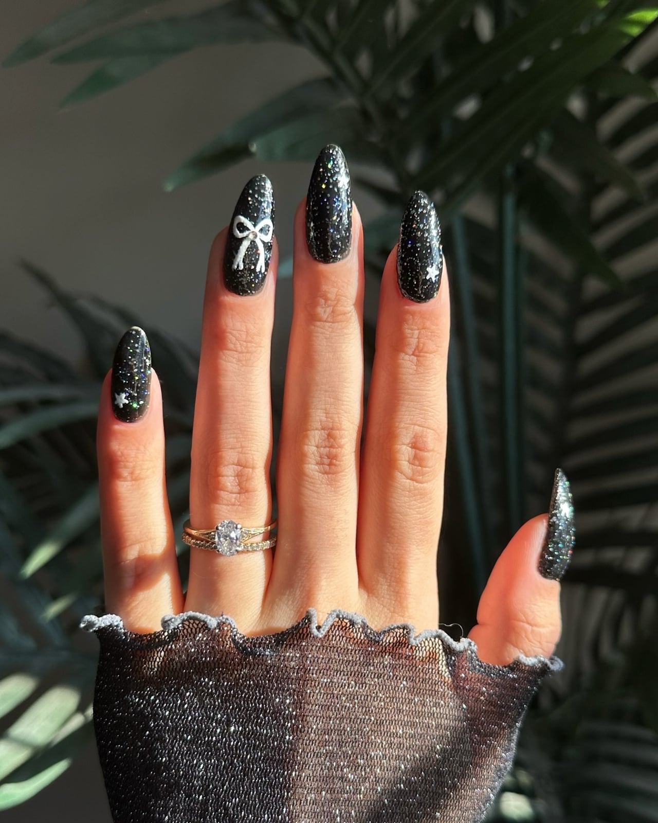 Long Almond Black Glitter White Bow Stars — New Years Eve Nails