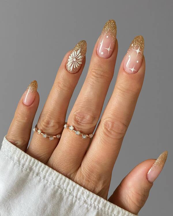 Long Almond Gold Glitter French Tips Starbursts, Glossy — New Years Eve Nails