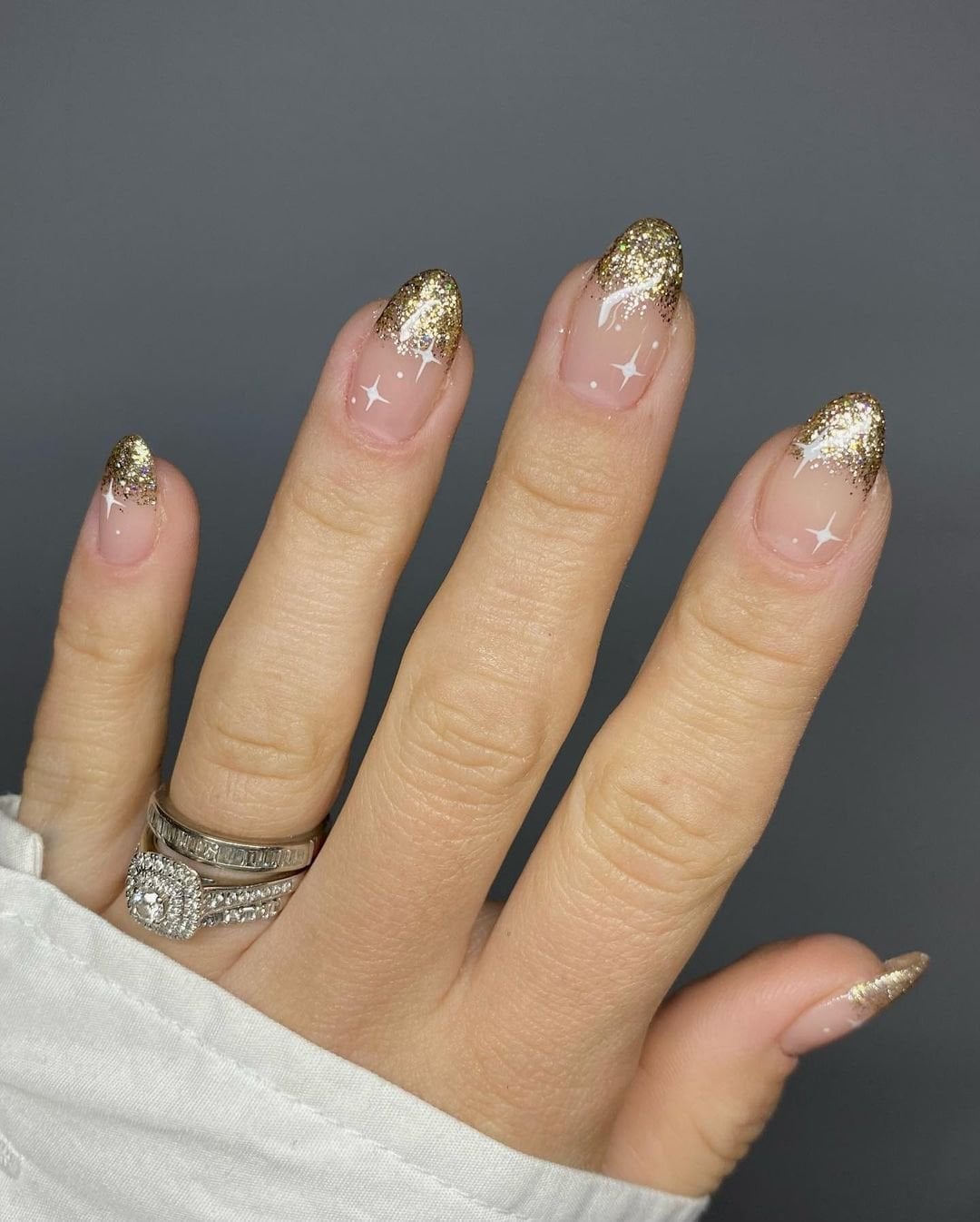 Short Almond Gold Glitter French Tips With Stars — New Years Eve Nails