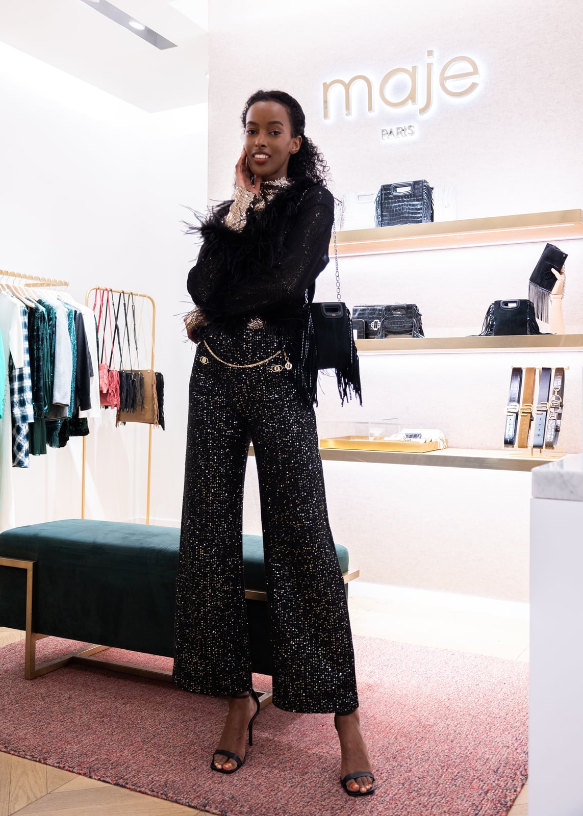 Feather trim top with sequined gold and black wide-leg trousers — New Years Outfit