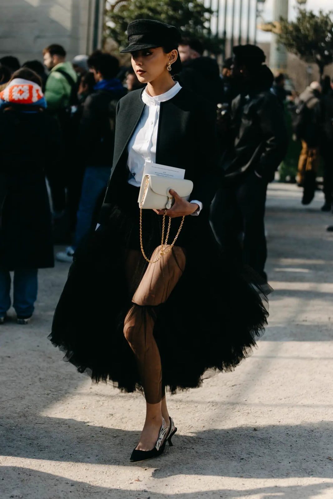 Black cape over white blouse and tulle skirt — New Years Outfit